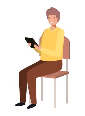 adam okul sandalyesinde tablet kullanarak oturan