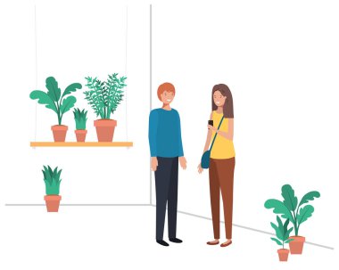 ev bitki ve akıllı telefon ile genç çift