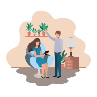 oturma odasında tablet kullanan çift