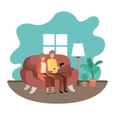 oturma odasında tablet kullanan çift