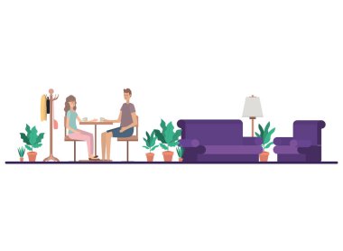 Oturma odasında kahve içen çift.