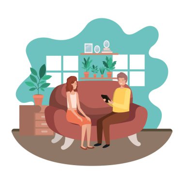 oturma odasında tablet kullanan çift