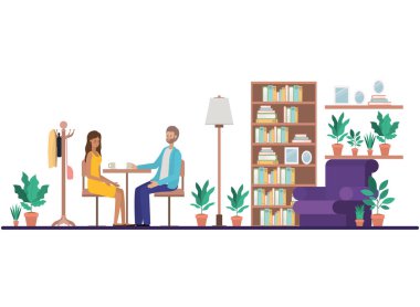 Oturma odasında kahve içen çift.