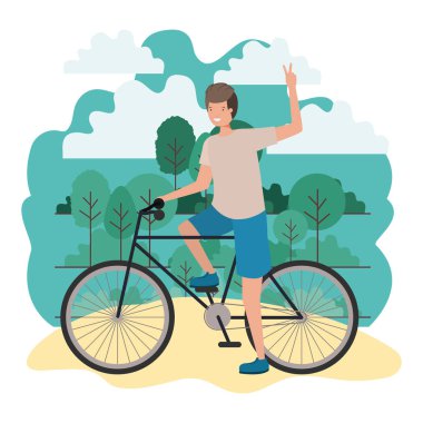 Parkta bisiklet sporu yapan genç adam.