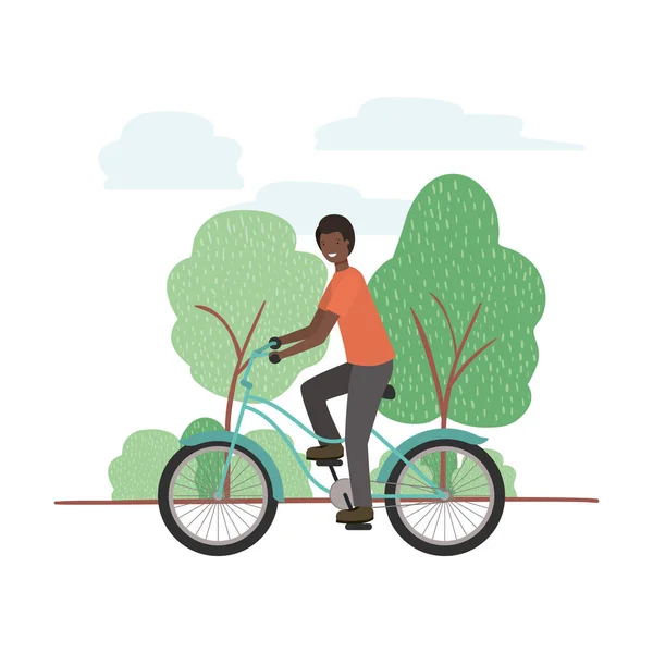 Mladý muž na kole v krajině — Stockový vektor