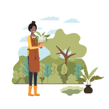 Ağaçlı bir kadın manzarada dikmek için