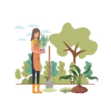 Ağaçlı bir kadın manzarada dikmek için