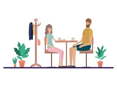 Oturma odasında kahve içen çift.