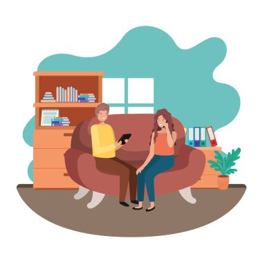 oturma odasında teknoloji cihazları kullanarak çift