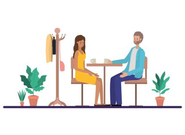 Oturma odasında kahve içen çift.