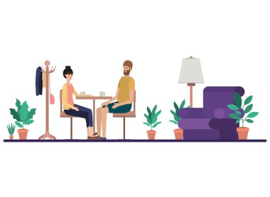 Oturma odasında kahve içen çift.