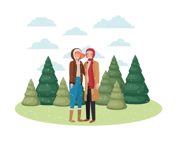 Casal com roupas de inverno e pinheiros de inverno caráter avatar — Vetor de Stock