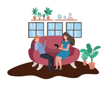 oturma odasında teknoloji cihazları kullanarak çift