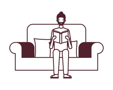 elinde kitap ile sandalyede oturan adam