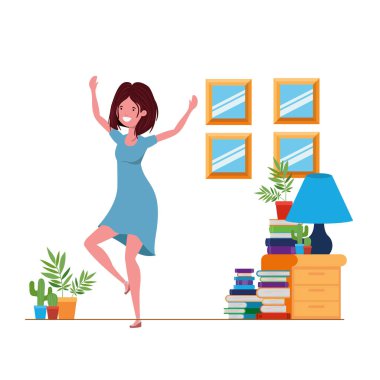 Genç bir kadın oturma odasında dans ediyor.