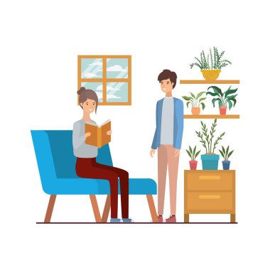 oturma odasında elinde kitap ile çift