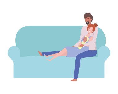 woman and man with newborn baby sitting on sofa