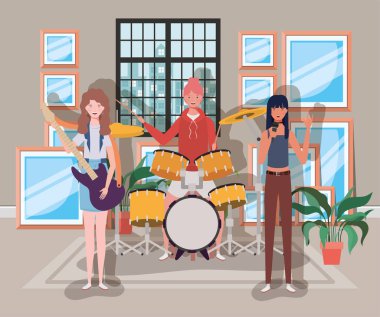 odada enstrüman çalan bir grup kadın