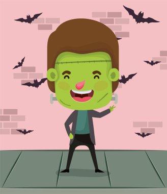 duvarda frankenstein kostümü ve uçan yarasalar ile küçük çocuk
