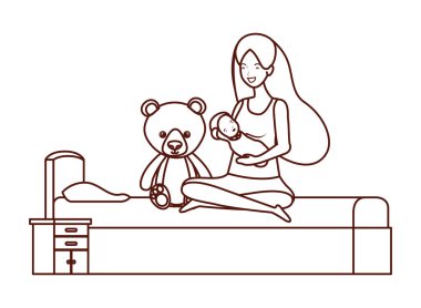 küçük çocuk ile sevimli gebelik anne yatak odasında oturan