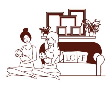 oturma odasında küçük bebekler ile sevimli gebelik anneler