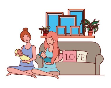 sevimli gebelik anneler yatak odasında küçük bebekler kaldırma oturmuş