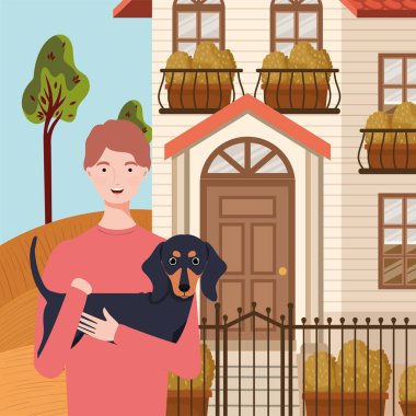 Sonbahar şehri sahnesinde sevimli köpek maskotu olan genç bir adam.