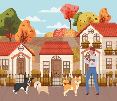 sonbahar şehir sahnesinde sevimli köpekler maskotlar ile genç adam