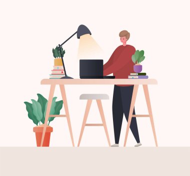 Dizüstü bilgisayarı olan adam masa başı vektör tasarımında çalışıyor.