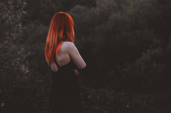 Girl's back is over the cliff