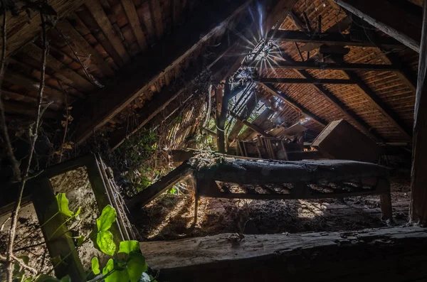 Bed on a loft with sunbeams — Stock Photo, Image