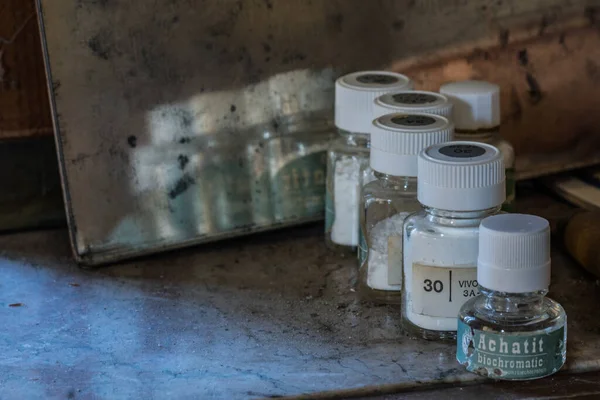 different medication powder in container in a house