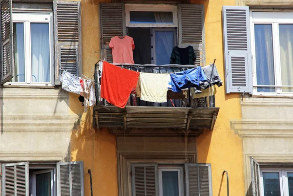France. Nice. In the old house on the balcony is drying colorful underwear.