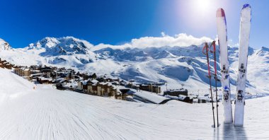 Ski in winter season, view from ski run at mountains and Val Thorens resort in sunny day in France, Alps clipart
