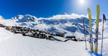 Ski in winter season, view from ski run at mountains and Val Thorens resort in sunny day in France, Alps clipart