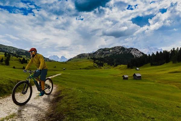 Single mountain bike rider on electric bike, e-mountainbike ride