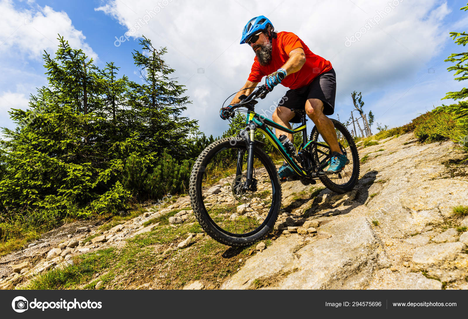Mountain biker riding on bike in summer forest landsca Stock Photo by ©Gorilla 294575696