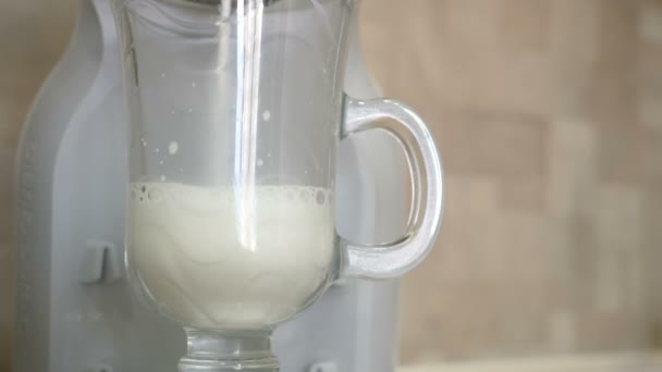 Coffee machine pouring latte in glass. — Stock Video