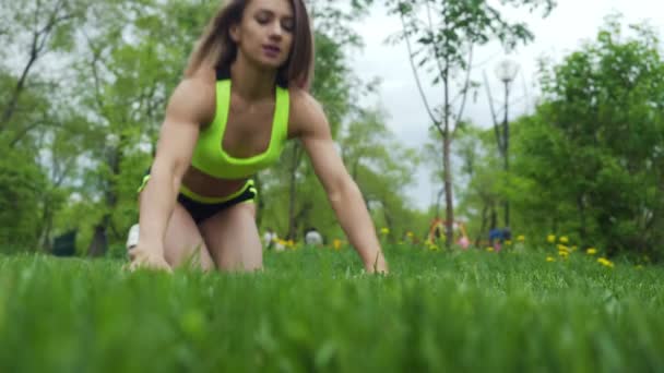 Athletic young female doing push ups — Stock Video