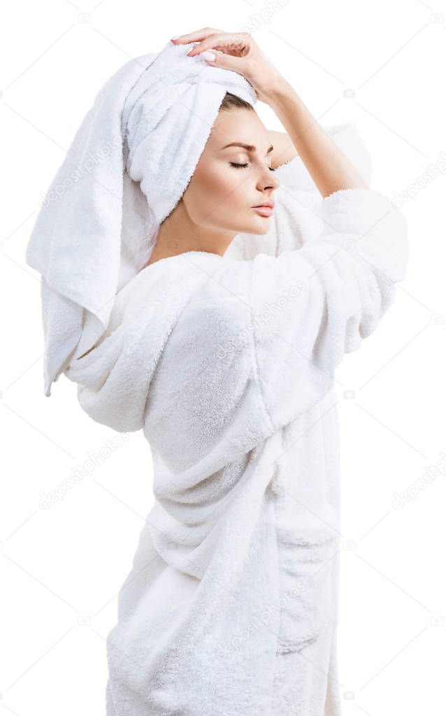 Young woman face with perfect skin and bath towel on head.