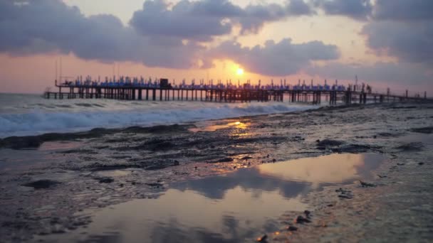 Beautiful view on coast pier on rocky beach. — Stock Video