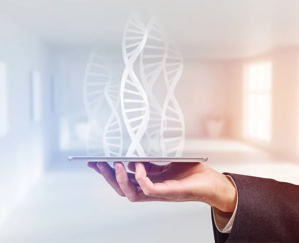 Hand holds tablet computer and dna molecule projection. — Stock Photo, Image