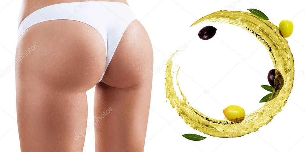 Female buttocks near swirl olive oil. Dieting concept.
