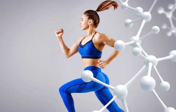 Sporty young woman running and jumping near molecules structure. — Stock Photo, Image