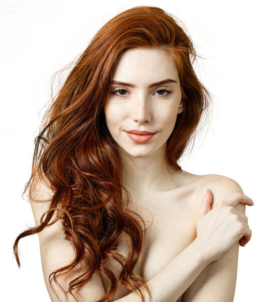 Redhead woman with cute smile and perfect skin.