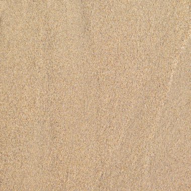 Deniz kenarı, doğal yüzeyin temiz kum dokusu üst görünümü.