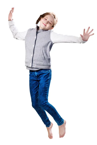 Cute smiling little girl jumping up. — Stock Photo, Image