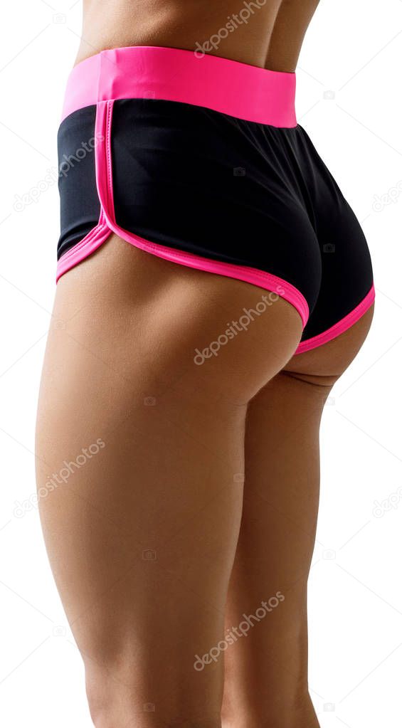 Athletic woman demonstrated her perfect muscular buttocks.