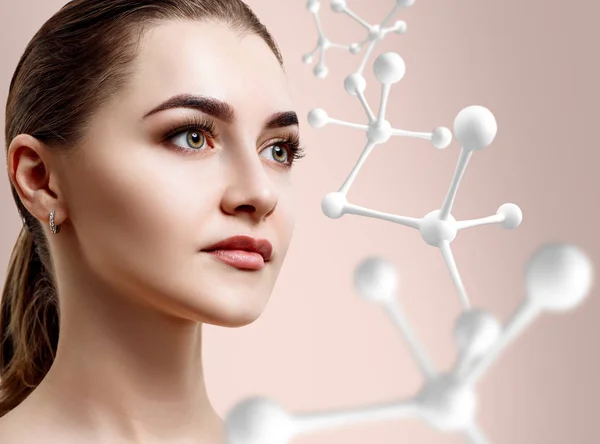 Beautiful woman near big white molecule chain. — Stock Photo, Image