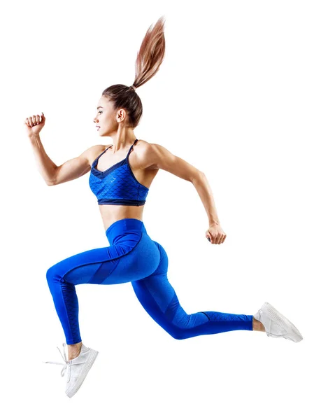 Jonge vrouw runner in blauwe sportkleding springen in de lucht. — Stockfoto